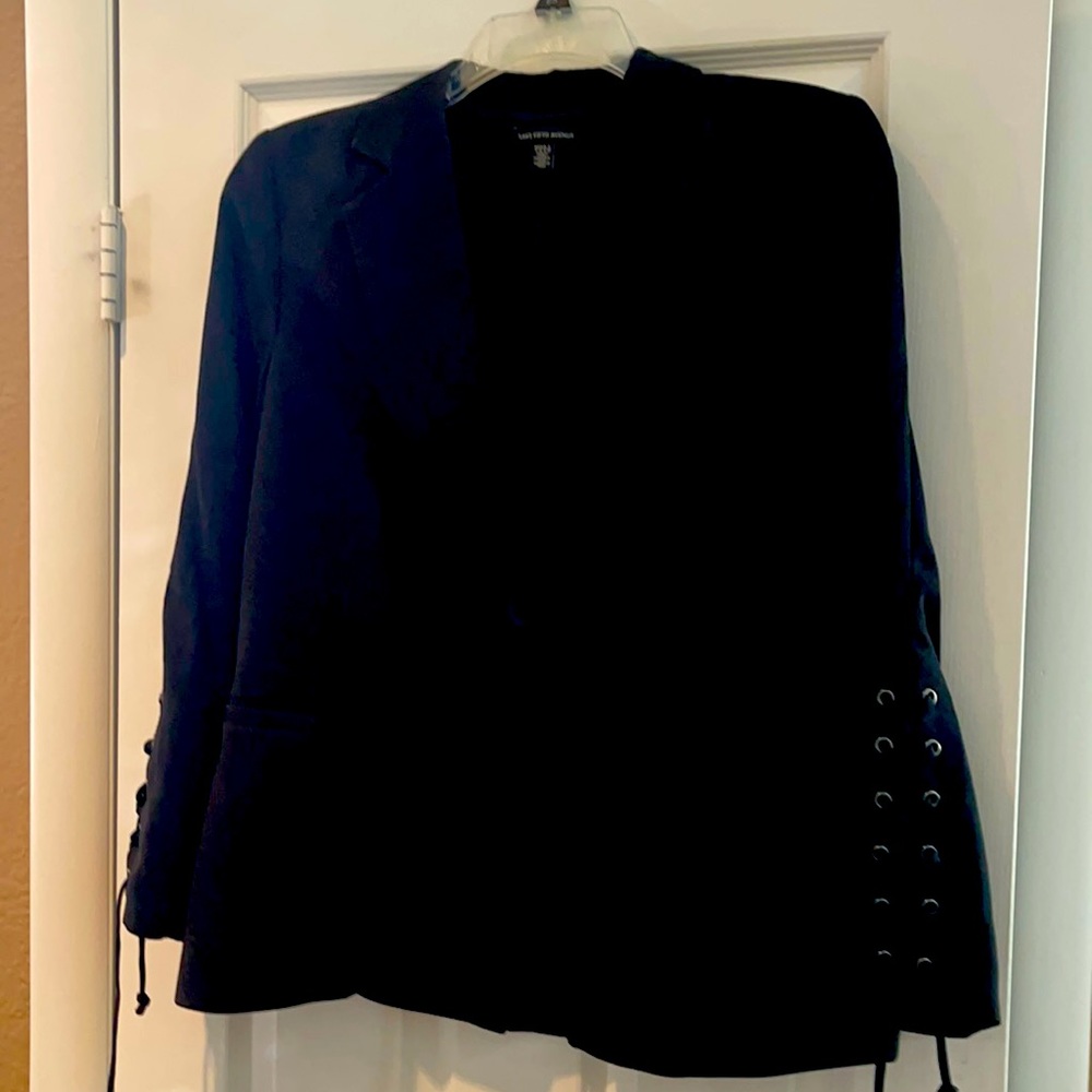 A woman’s black Saks fifth Avenue blazer size large with unique sleeves